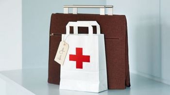 Work bag and paper bag with a red cross and a tag saying "for grandpa"