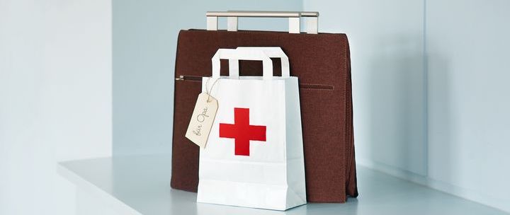 Work bag and paper bag with red cross and note "for grandpa" 