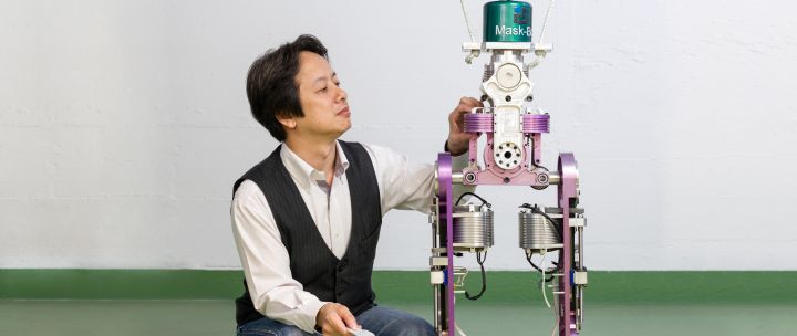 Professor Gordong Cheng with one of his research robots